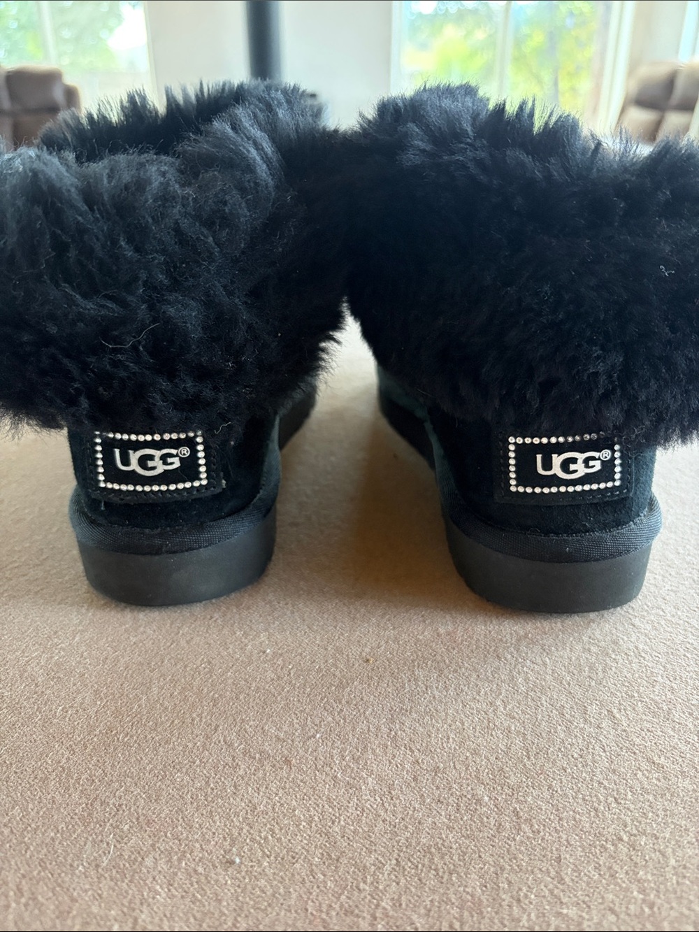 UGG Black Shearling Mini Boots with Rhinestone Logo Patch